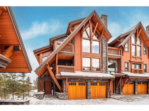 201-2100E Stewart Creek Drive, Canmore, AB - Outdoor With Facade