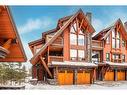 201-2100E Stewart Creek Drive, Canmore, AB  - Outdoor With Facade 