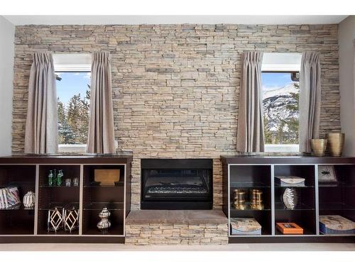 201-2100E Stewart Creek Drive, Canmore, AB - Indoor With Fireplace