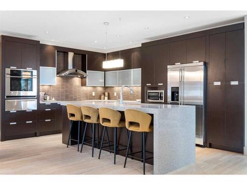 201-2100E Stewart Creek Drive, Canmore, AB - Indoor Photo Showing Kitchen With Upgraded Kitchen