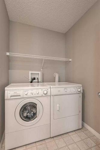 129 Millrise Square Sw, Calgary, AB - Indoor Photo Showing Laundry Room