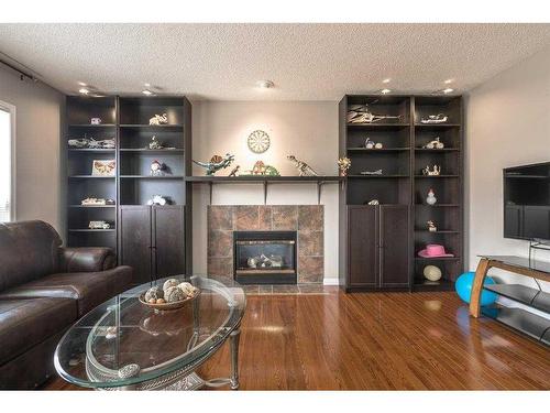 129 Millrise Square Sw, Calgary, AB - Indoor Photo Showing Living Room With Fireplace