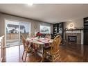 129 Millrise Square Sw, Calgary, AB  - Indoor Photo Showing Dining Room With Fireplace 