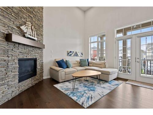 411 Windrow Common Sw, Airdrie, AB - Indoor Photo Showing Living Room With Fireplace