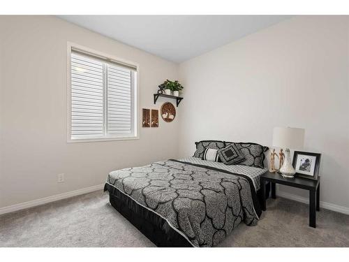 411 Windrow Common Sw, Airdrie, AB - Indoor Photo Showing Bedroom