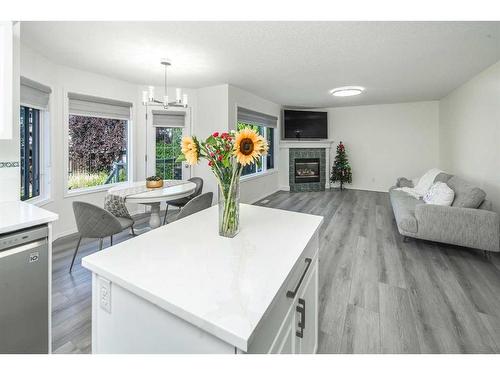 103 Tuscany Ridge View Nw, Calgary, AB - Indoor Photo Showing Living Room With Fireplace