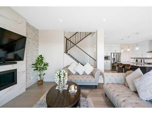 185 Carringvue Manor Nw, Calgary, AB - Indoor Photo Showing Living Room With Fireplace