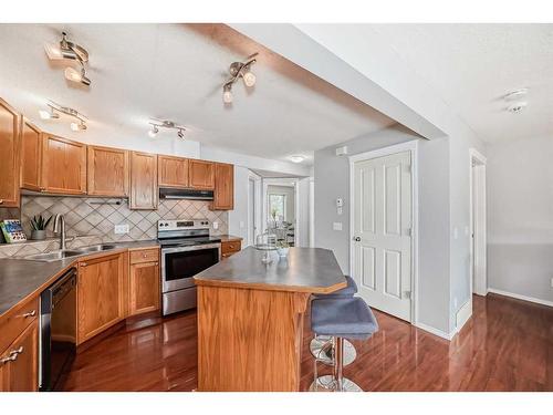 409-140 Sagewood Boulevard Sw, Airdrie, AB - Indoor Photo Showing Kitchen With Double Sink