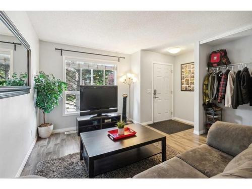 60 Erin Woods Court Se, Calgary, AB - Indoor Photo Showing Living Room