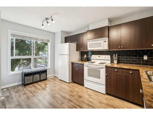 60 Erin Woods Court Se, Calgary, AB - Indoor Photo Showing Kitchen