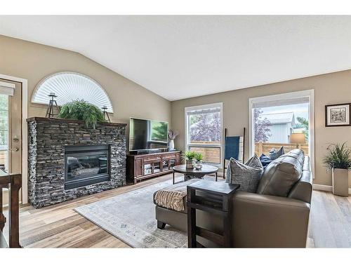 378009 232 Street West, Rural Foothills County, AB - Indoor Photo Showing Living Room With Fireplace