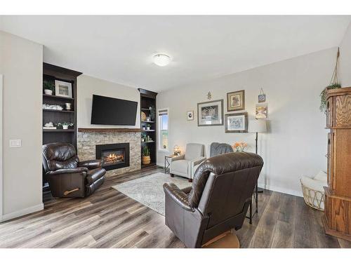 2132 Ravensdun Crescent Se, Airdrie, AB - Indoor Photo Showing Living Room With Fireplace