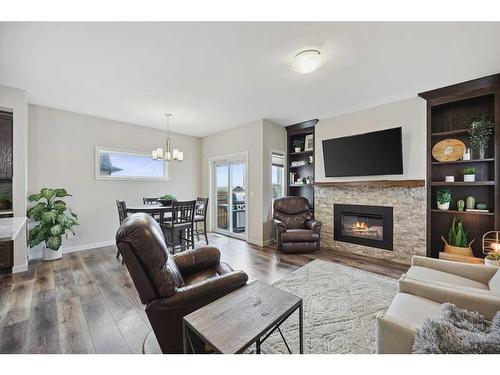 2132 Ravensdun Crescent Se, Airdrie, AB - Indoor Photo Showing Living Room With Fireplace