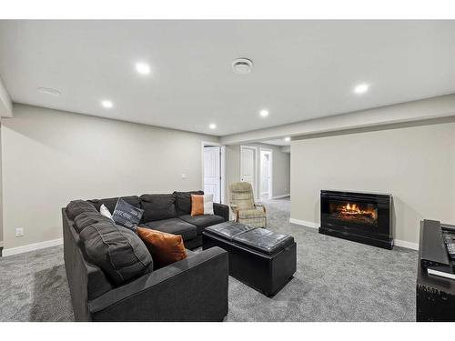 2132 Ravensdun Crescent Se, Airdrie, AB - Indoor With Fireplace