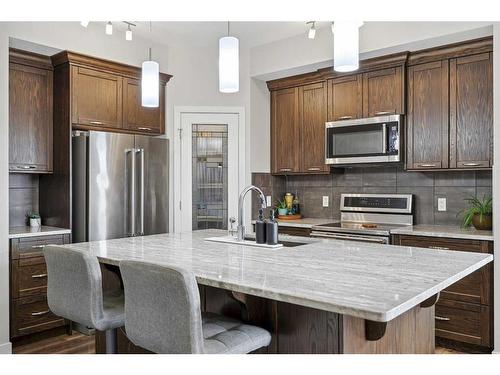 2132 Ravensdun Crescent Se, Airdrie, AB - Indoor Photo Showing Kitchen With Stainless Steel Kitchen With Upgraded Kitchen