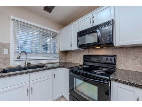 217-36 Glamis Green Sw, Calgary, AB - Indoor Photo Showing Kitchen With Double Sink