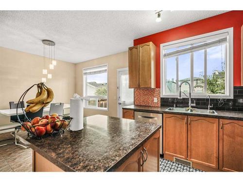 152 Silverado Plain Close, Calgary, AB - Indoor Photo Showing Kitchen With Double Sink