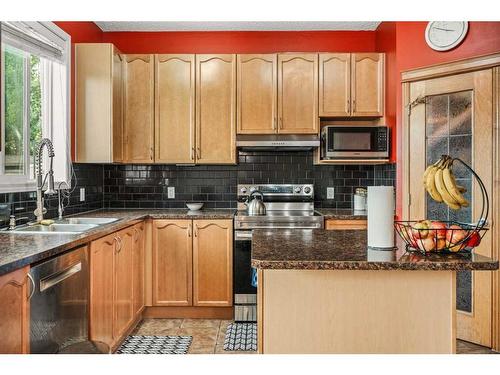 152 Silverado Plain Close, Calgary, AB - Indoor Photo Showing Kitchen With Double Sink