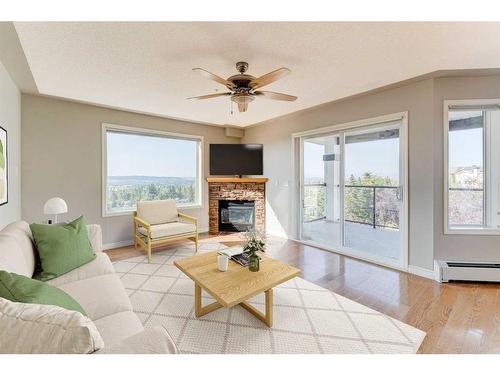 306-345 Rocky Vista Park Nw, Calgary, AB - Indoor Photo Showing Living Room With Fireplace