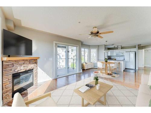 306-345 Rocky Vista Park Nw, Calgary, AB - Indoor Photo Showing Living Room With Fireplace