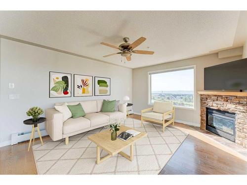 306-345 Rocky Vista Park Nw, Calgary, AB - Indoor Photo Showing Living Room With Fireplace