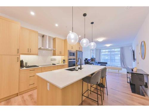 301-20 Sage Hill Walk Nw, Calgary, AB - Indoor Photo Showing Kitchen With Double Sink With Upgraded Kitchen