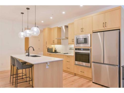 301-20 Sage Hill Walk Nw, Calgary, AB - Indoor Photo Showing Kitchen With Stainless Steel Kitchen With Upgraded Kitchen