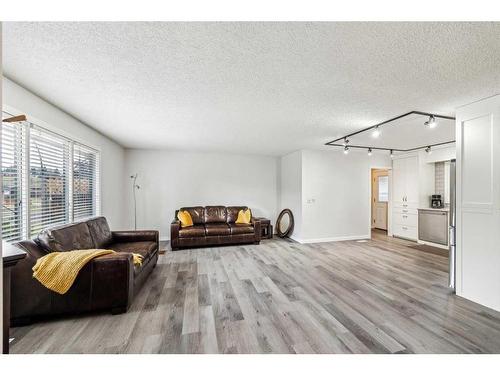 1436 Lake Ontario Drive Se, Calgary, AB - Indoor Photo Showing Living Room