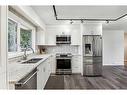 1436 Lake Ontario Drive Se, Calgary, AB  - Indoor Photo Showing Kitchen With Double Sink With Upgraded Kitchen 