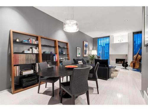 2036 31 Avenue Sw, Calgary, AB - Indoor Photo Showing Dining Room With Fireplace