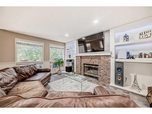 64 Santana Hill Nw, Calgary, AB - Indoor Photo Showing Living Room With Fireplace