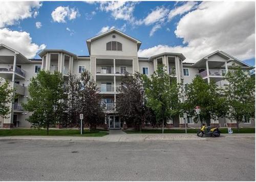 1405-17 Country Village Bay Ne, Calgary, AB - Outdoor With Balcony With Facade