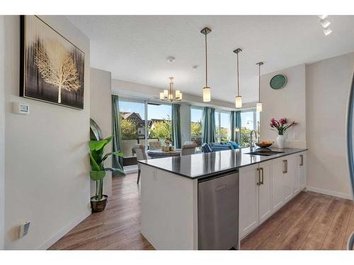 201-2231 Mahogany Boulevard Se, Calgary, AB - Indoor Photo Showing Kitchen With Upgraded Kitchen