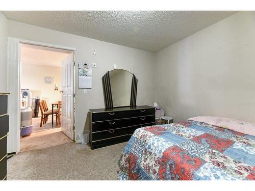 143-1717 60 Street Se, Calgary, AB - Indoor Photo Showing Bedroom