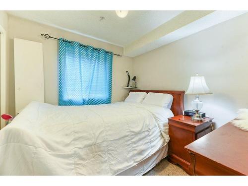 143-1717 60 Street Se, Calgary, AB - Indoor Photo Showing Bedroom