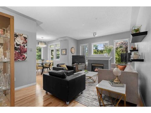 206-2416 Erlton Street Sw, Calgary, AB - Indoor Photo Showing Living Room With Fireplace