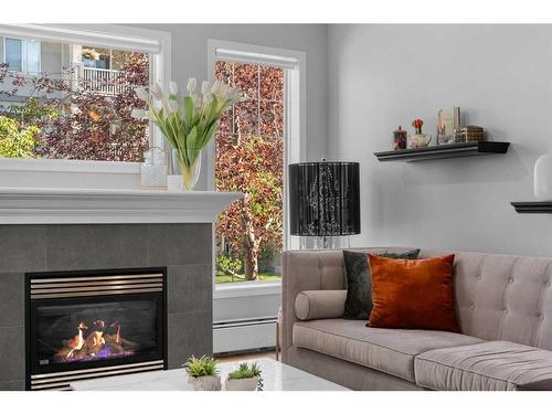 206-2416 Erlton Street Sw, Calgary, AB - Indoor Photo Showing Living Room With Fireplace