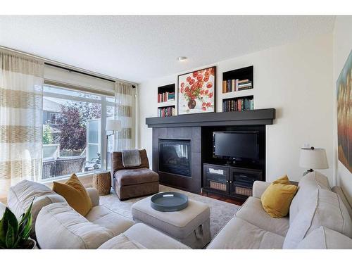 311 Royal Oak Circle Nw, Calgary, AB - Indoor Photo Showing Living Room With Fireplace