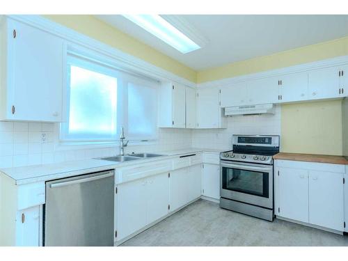 2403 54 Avenue Sw, Calgary, AB - Indoor Photo Showing Kitchen With Double Sink