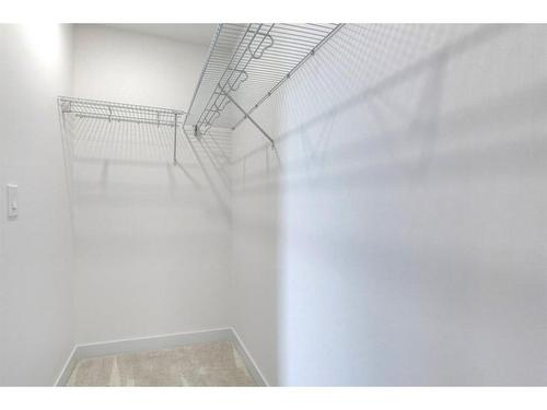 50 Na'A Heights Sw, Calgary, AB - Indoor With Storage