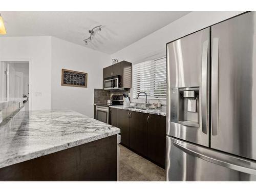 1217-604 East Lake Boulevard Ne, Airdrie, AB - Indoor Photo Showing Kitchen With Stainless Steel Kitchen With Double Sink