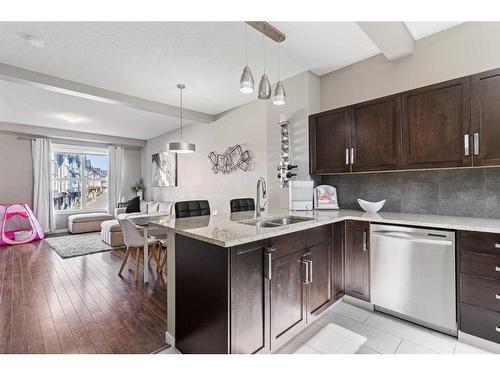 84 New Brighton Landing Se, Calgary, AB - Indoor Photo Showing Kitchen With Double Sink