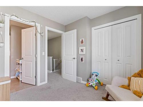 84 New Brighton Landing Se, Calgary, AB - Indoor Photo Showing Bedroom