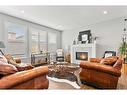 203 Bayview Circle Sw, Airdrie, AB  - Indoor Photo Showing Living Room With Fireplace 