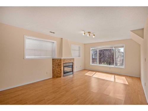 144 Arbour Stone Crescent Nw, Calgary, AB - Indoor Photo Showing Living Room With Fireplace