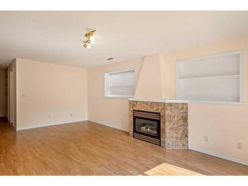 144 Arbour Stone Crescent Nw, Calgary, AB - Indoor With Fireplace