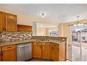 144 Arbour Stone Crescent Nw, Calgary, AB  - Indoor Photo Showing Kitchen With Double Sink 