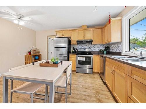 347 Huntbourne Way Ne, Calgary, AB - Indoor Photo Showing Kitchen With Double Sink