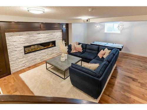 107 Auburn Sound Manor Se, Calgary, AB - Indoor Photo Showing Living Room With Fireplace