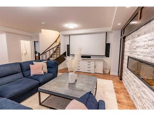 107 Auburn Sound Manor Se, Calgary, AB - Indoor Photo Showing Living Room With Fireplace